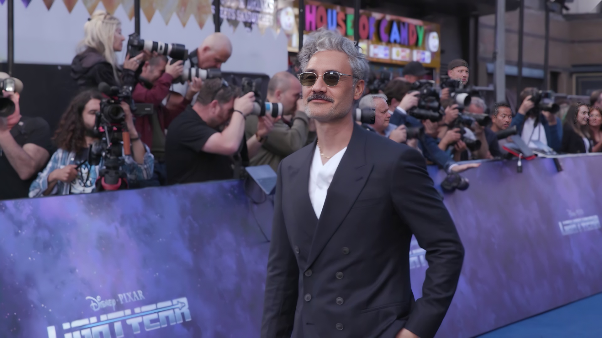 Marvel premieres reveal his relaxed style. Bold suits often match the occasion.